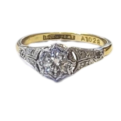 106 - AN EARLY 20TH CENTURY 18CT GOLD AND DIAMOND SOLITAIRE RING
Having a single round cut diamond and dia... 