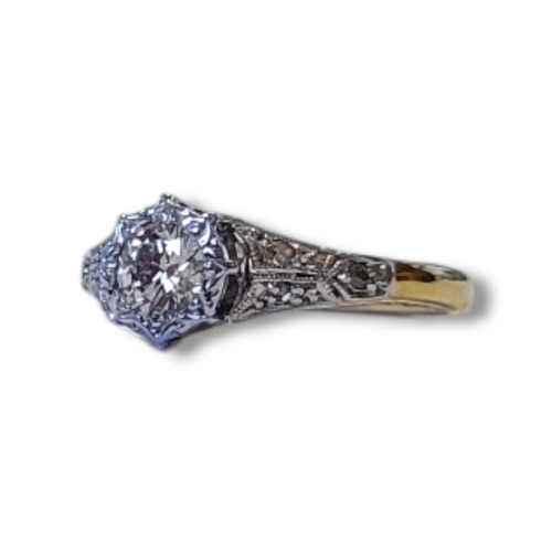 106 - AN EARLY 20TH CENTURY 18CT GOLD AND DIAMOND SOLITAIRE RING
Having a single round cut diamond and dia... 