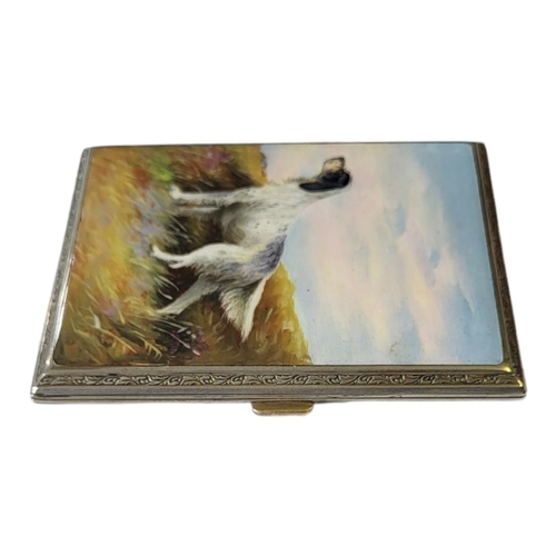 117 - AN EDWARDIAN GILT METAL AND ENAMEL CIGARETTE CASE
Black and white hunting dog within a Scottish land... 