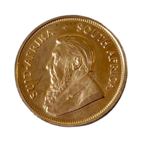 183 - A 22CT GOLD 1OZ KRUGERRAND COIN, DATED 1974 
With portrait of President Kruger and springbok to reve... 