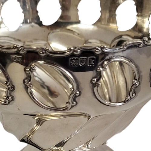 186 - AN EDWARDIAN SILVER BOWL
Having a scrolled edge,pierced border and wreathed flutes to base, hallmark... 