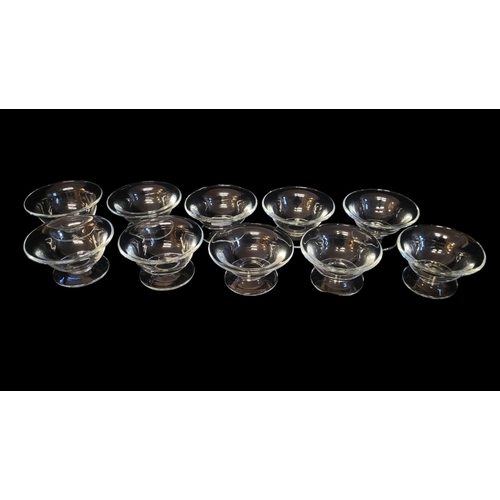 203 - WILLIAM YEOWARD,A SET OF TEN LEAD CRYSTAL DESSERT BOWLS
Plain form with flared rim and etched mark t... 