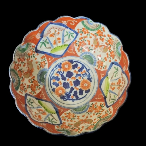 258 - A LATE 18TH CENTURY JAPANESE IMARI PATTERN BOWL
Decorated in underglaze blue with bamboo irises and ... 