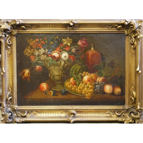 27 - AN EARLY 19TH CENTURY DUTCH SCHOOL OIL ON CANVAS, STILL LIFE
Flowers and fruit, in a heavy gilt fram... 