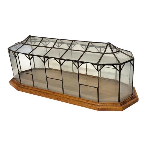 199 - A MODERN MODEL OF ORANGERIE PLANTS GREENHOUSE GLASS COVERED ON SOLID OAK RECTANGULAR BASE.
(h 59cm x... 