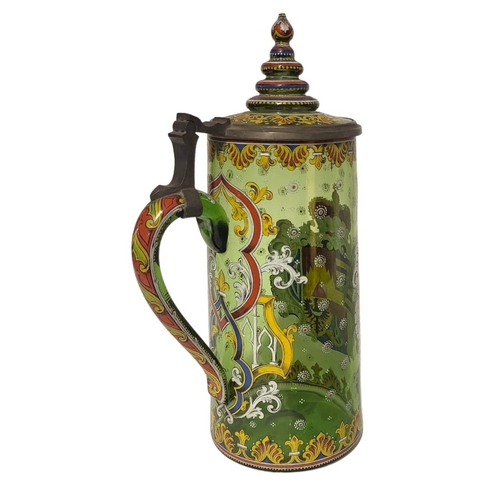 187 - A LARGE LATE 19TH/EARLY 20TH CENTURY AUSTRIAN GREEN GLASS AND ENAMEL ARMORIAL TANKARD 
Having a sing... 