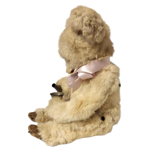 232 - A LATE 19TH/EARLY 20TH CENTURY 'DRINKING BEAR' AUTOMATON
Having white animal fur with skin hide hand... 