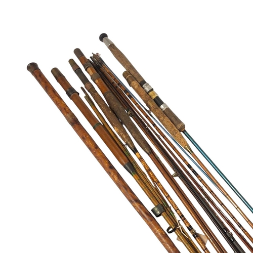 235 - A COLLECTION OF FOUR EARLY 20TH CENTURY CANE FISHING RODS
To include two rods with cork handles, tog... 