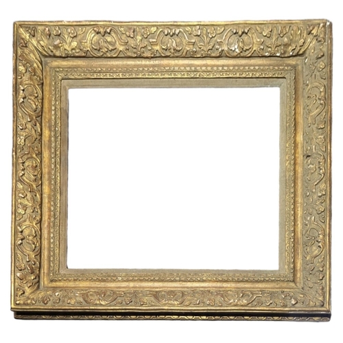 621 - A 19TH CENTURY GILDED RECTANGULAR PICTURE FRAME
With carved scrolled  decoration.
(aperture approx 5... 