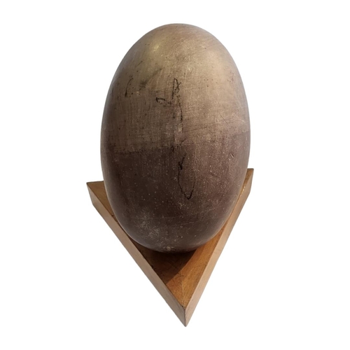 362 - A VINTAGE INDIAN SHIVA LINGAM STONE
Oval egg form, on fitted wooden base.
(stone approx 22cm)

Condi... 