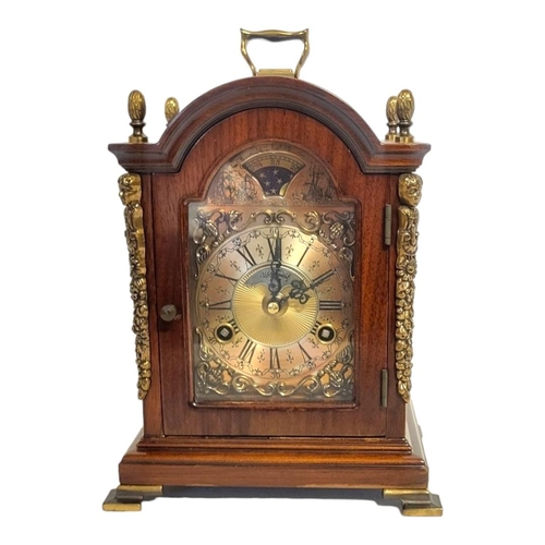 366 - WARMINK, A 20TH CENTURY MAHOGANY AND BRASS MANTEL CLOCK
Single brass handle with acorn finials and b... 