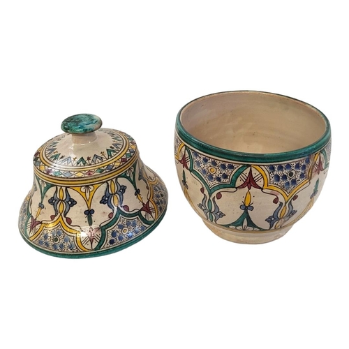 375 - A 20TH CENTURY IZNIK POTTERY JAR AND COVER
Having a bell form cover and hand painted decoration, mar... 