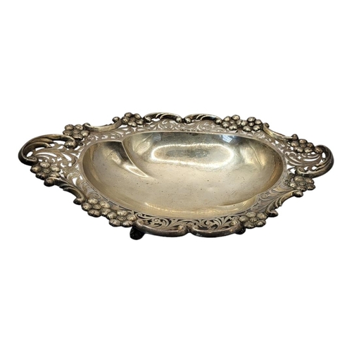 1 - AN EDWARDIAN SILVER SWEETMEAT DISH
Having a scrolled and pierced border, hallmarked S. Glass, Birmin... 