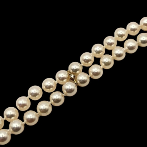 10 - MIKIMOTO, AN 18CT GOLD, DIAMOND AND PEARL BRACELET
Two rows of cultured Pearl's,interspersed with 18... 