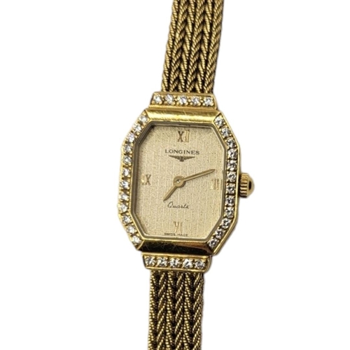 13 - LONGINES, A VINTAGE 18CT GOLD AND DIAMOND LADIES’ WRISTWATCH
The octagonal gold tone dial with diamo... 