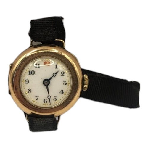 132 - AN EARLY 20TH CENTURY 9CT GOLD LADIES’ WRISTWATCH
Having red twelve and fabric strap.
(approx 2.5cm)... 