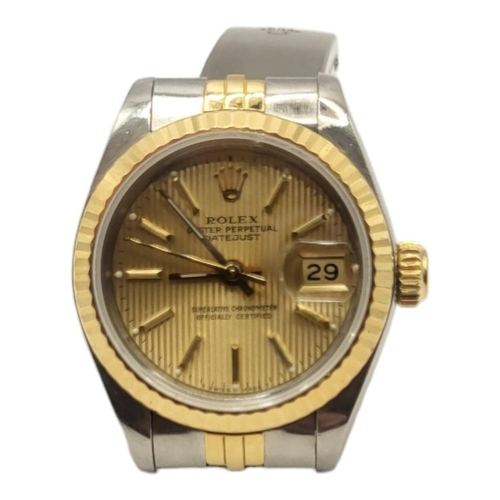 138 - ROLEX, DATEJUST, A VINTAGE  18CT GOLD AND STAINLESS STEEL LADIES’ WRISTWATCH
Gold tone textured dial... 