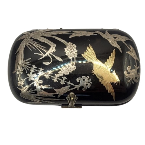 148 - A 19TH CENTURY TORTOISESHELL, GOLD AND SILVER 'PIQUE’ OVAL CIGARETTE BOX
With inlaid bird in flight ... 