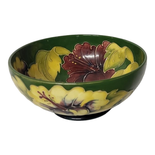 249 - A MID 20TH CENTURY WALTER MOORCROFT POTTERY PEDESTAL BOWL IN HIBISCUS PATTERN
Interior and exterior ... 