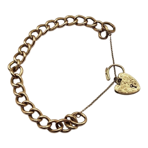 24A - AN EARLY 9CT GOLD OVAL CURB LINK BRACELET
Pierced textured links, with heart form clasp.
(approx 10c... 