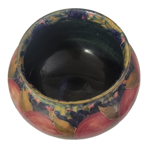 252 - WILLIAM MOORCROFT, AN EARLY 20TH CENTURY OVOID POTTERY JARDINIÈRE, CIRCA 1920
Pomegranate pattern, t... 