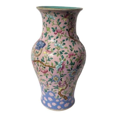 450 - A LATE QING DYNASTY CHINESE FAMILLE ROSE PORCELAIN BALUSTER VASE, CIRCA 1900
Flora pattern, body pol... 