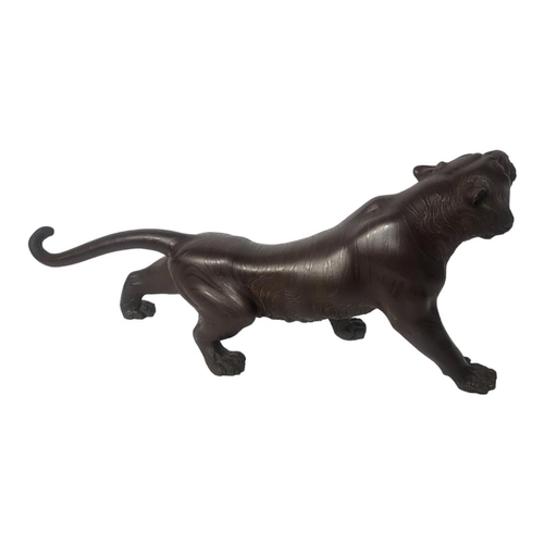 451 - A JAPANESE MEIJI PERIOD, 1868 - 1911, PATINATED BRONZE MODEL OF A TIGER
Naturalistically modelled in... 