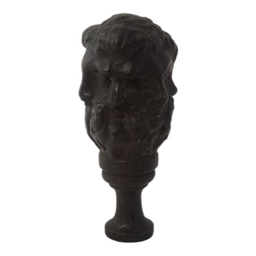 306 - A 19TH CENTURY BRONZE NEOCLASSICAL DESK SEAL
Facial masks on pedestal base.
(approx 7.5cm)

Conditio... 