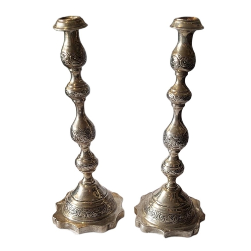 32 - A PAIR OF VINTAGE SILVER CANDLESTICKS
Having engraved decoration and scalloped base, hallmarked Shef... 