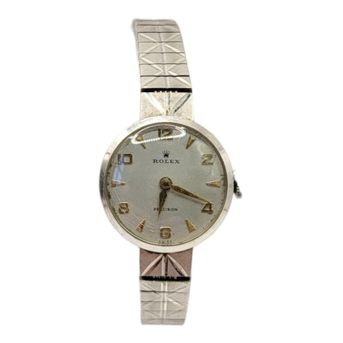 35 - ROLEX, PRECISION, A VINTAGE 9CT WHITE GOLD LADIES’ WRISTWATCH
Silver tone dial with Arabic quarter n... 