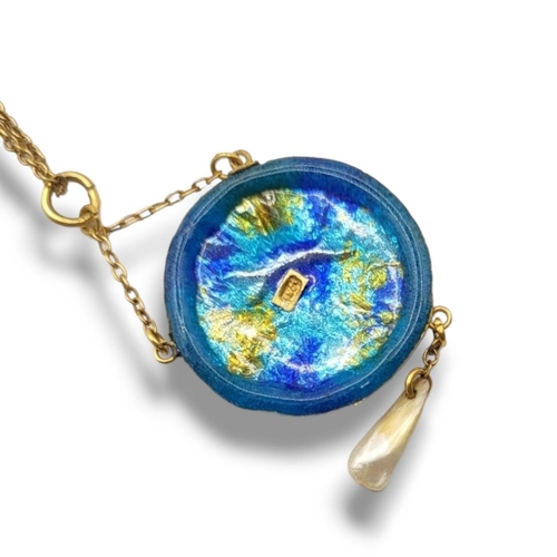 39 - AN EARLY 20TH CENTURY 15CT GOLD, GUILLOCHÈ ENAMEL AND MOTHER OF PEARL PENDANT
Circular form with tur... 