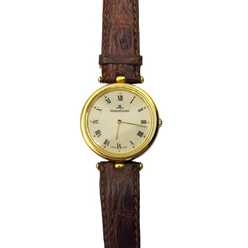 4 - JAEGER LECOULTRE, A VINTAGE 18CT GOLD GENT’S WRISTWATCH
Slim case with circular white dial with Roma... 