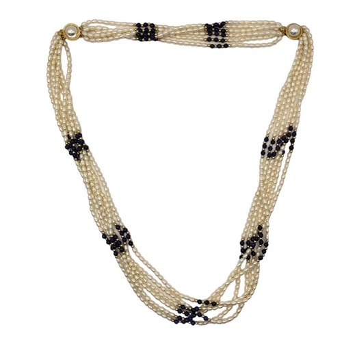 48 - A COLLECTION OF CULTURED RICE BEAD PEARL NECKLACES
To include two multi strand beads set with blue a... 