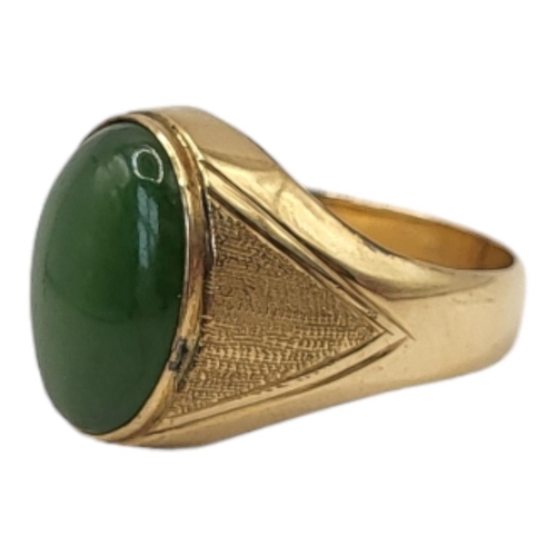 66 - A CONTINENTAL 18CT GOLD AND JADE GENT’S SIGNET RING
Cabochon cut stone in a textured gold mount (tes... 