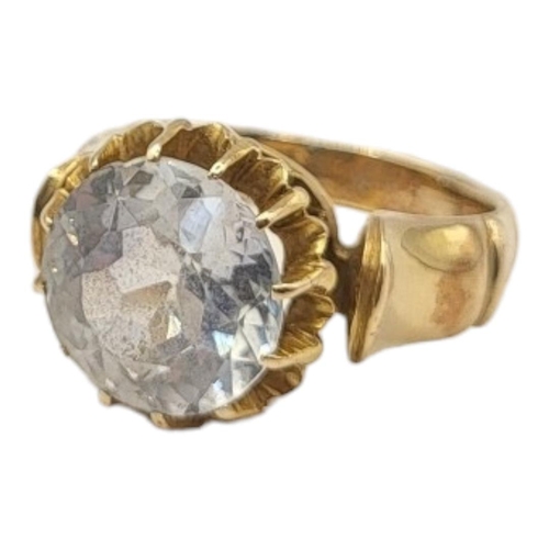 79A - A VINTAGE YELLOW METAL AND SAPPHIRE RING
Having a single pale blue sapphire in a stepped design. 
(s... 