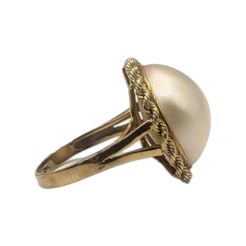 80 - A CONTINENTAL 14CT GOLD AND PEARL RING
The single pearl in a rope twist design on a plain gold mount... 