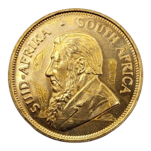 8A - A 22CT GOLD FULL 1OZ KRUGERRAND COIN, DATED 1975 
With portrait bust and springbok design to reverse... 