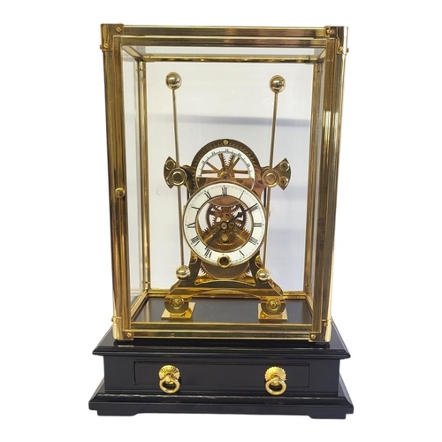 464 - A GILT BRASS AND ENAMEL 'GRASSHOPPER' SKELETON CLOCK
Having twin dials and pendulums, four glass pan... 