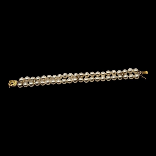 10 - MIKIMOTO, AN 18CT GOLD, DIAMOND AND PEARL BRACELET
Two rows of cultured Pearl's,interspersed with 18... 