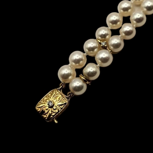 10 - MIKIMOTO, AN 18CT GOLD, DIAMOND AND PEARL BRACELET
Two rows of cultured Pearl's,interspersed with 18... 