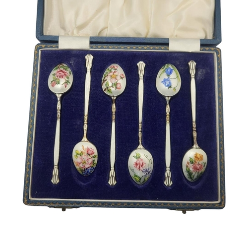 101A - A SET OF SIX VINTAGE SILVER AND ENAMEL TEASPOONS
Having painted floral decoration, hallmarked Barker... 