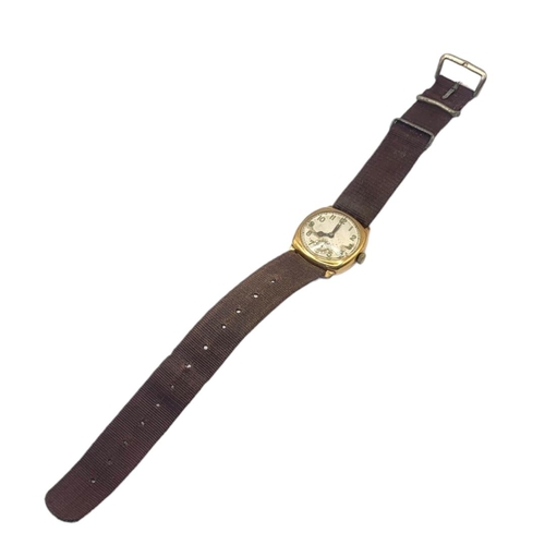 102 - AN EARLY 20TH CENTURY 9ct GOLD GENTS WRISTWATCH
Square form case on brown fabric strap, silver tone ... 