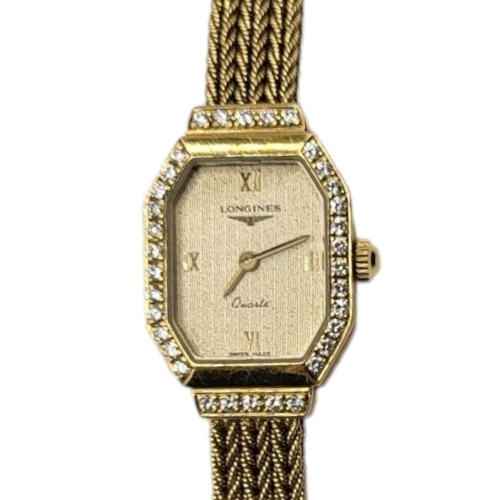 13 - LONGINES, A VINTAGE 18CT GOLD AND DIAMOND LADIES’ WRISTWATCH
The octagonal gold tone dial with diamo... 