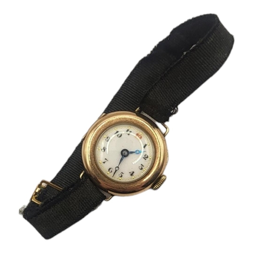 132 - AN EARLY 20TH CENTURY 9CT GOLD LADIES’ WRISTWATCH
Having red twelve and fabric strap.
(approx 2.5cm)... 