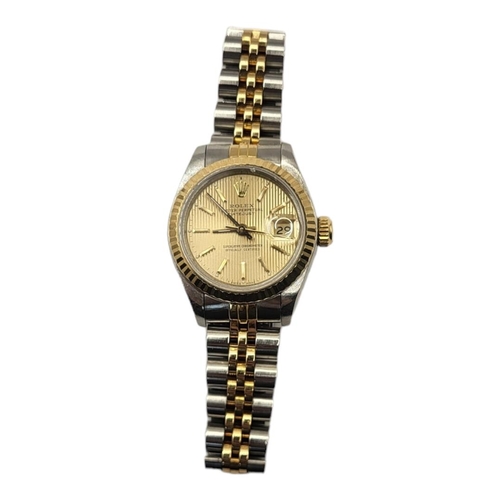 138 - ROLEX, DATEJUST, A VINTAGE  18CT GOLD AND STAINLESS STEEL LADIES’ WRISTWATCH
Gold tone textured dial... 