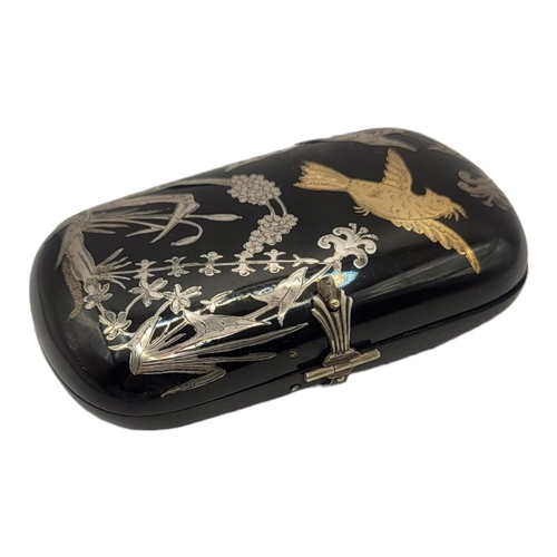 148 - A 19TH CENTURY TORTOISESHELL, GOLD AND SILVER 'PIQUE’ OVAL CIGARETTE BOX
With inlaid bird in flight ... 