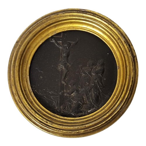 154 - A LATE 18TH/EARLY 19TH CENTURY BRONZE ECCLESIASTICAL ROUNDEL
Embossed with a crucifixion figural sce... 