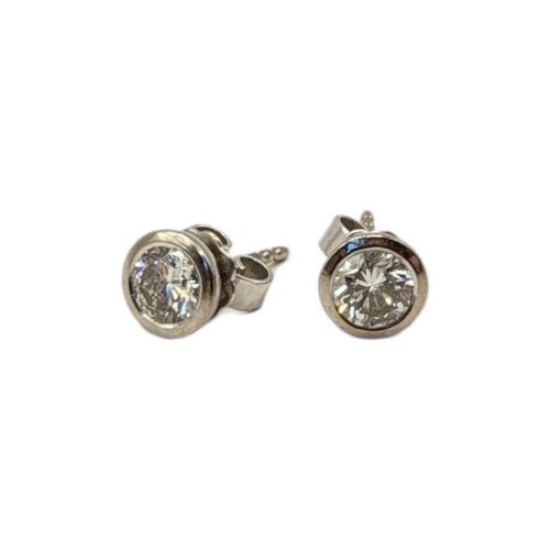 16 - WEMPE, A PAIR OF 18CT WHITE GOLD AND DIAMOND STUD EARRINGS
Each set with a single round cut diamond,... 