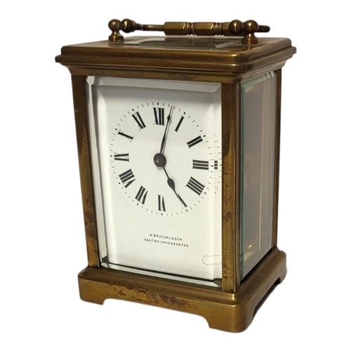 170 - A 20TH CENTURY GILT BRASS CARRIAGE CLOCK
Single handle and four bevelled glass panels, marked to dia... 