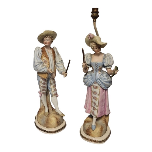 184 - A LARGE PAIR OF 19TH CENTURY FRENCH BISQUE PORCELAIN FIGURAL LAMPS
Male and female wearing colourful... 